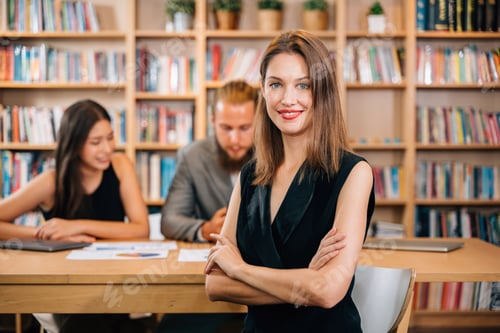 Preview: Confident businesswoman smiling and posing with arm crossed