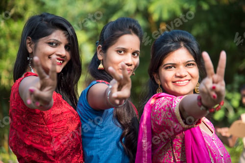 Preview: Happy Indian young girls smiling and having fun at outdoor.