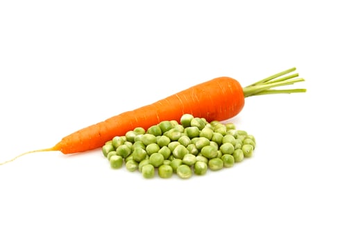 Preview: Carrot and green peas isolated on a whiteground.