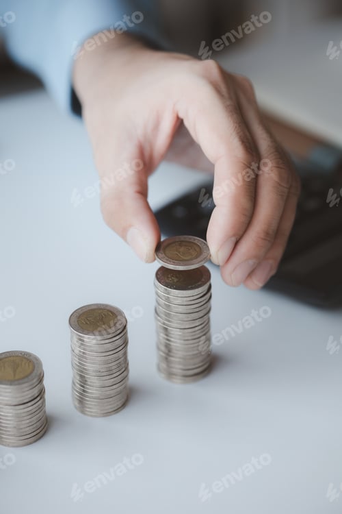 Preview: Person with pile of coins and piggy bank, money saving concept for future use and financial stabilit