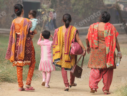 Preview: Closeup shot of four women walking in the park in New Delhi, India