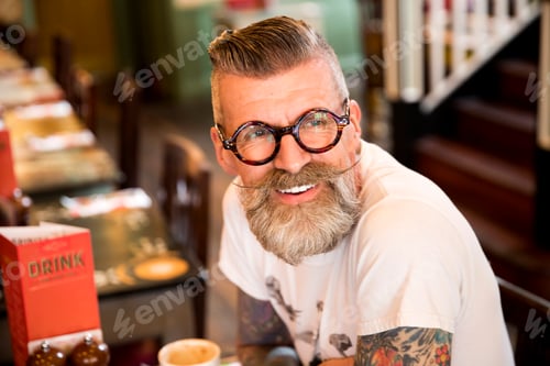 Preview: Quirky man in bar and restaurant, Bournemouth, England
