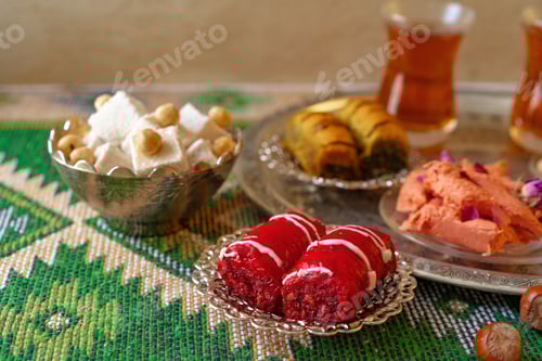 Preview: Turkish sweet baklava on metal tray with Turkish tea