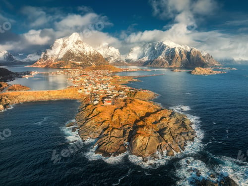 Preview: Aerial view of snowy mountains, blue sea, village at sunrise