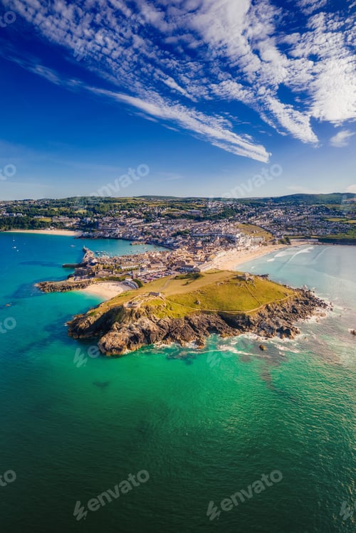 Preview: Aerial view of the rocky shore and town surrounded by sea. St Ives, Cornwall, England, UK.
