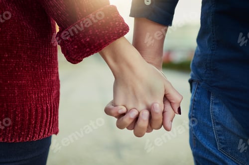 Preview: True love means never letting go. Cropped shot of a couple holding hands outdoors.