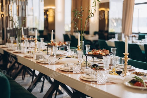 Preview: Elegant wedding table setting with appetizers, candles and crystal glasses