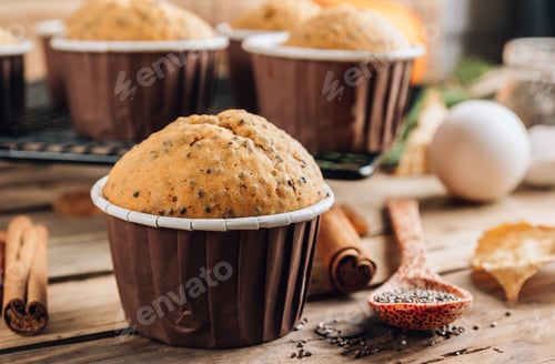 Preview: Fresh Baked Pumpkin Muffins with Cinnamon Sticks