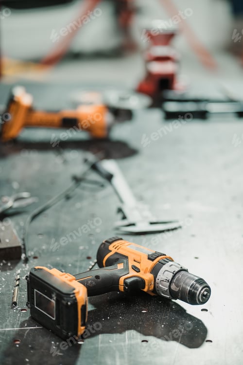 Preview: Power Drill on Metal Surface in an Industrial Setting