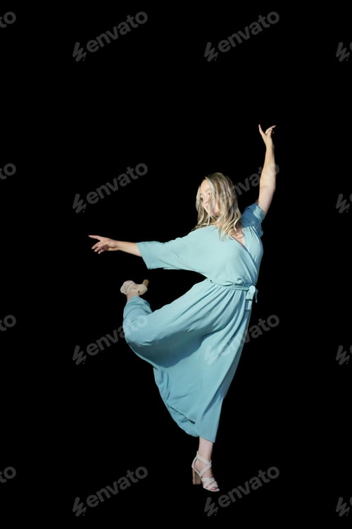 Preview: beautiful dancer in stylish dress with fringe performing tango on black background