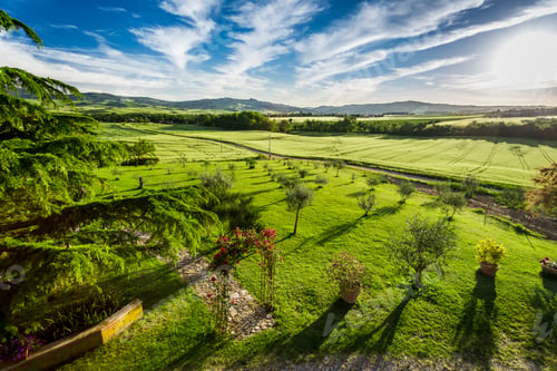 Preview: Sunset over the green valley in Tuscany