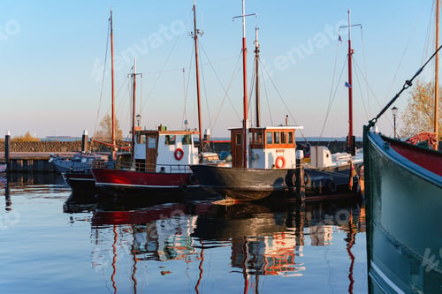 Preview: Classic Fishing Boats Moored In Calm Harbor Water