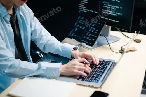 Preview: Male programmer using stylus to analyze code on tablet and monitor. Software development, coding,
