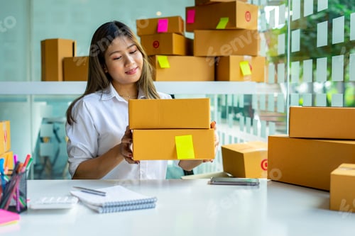 Preview: Starting small businesses SME owners female entrepreneurs Preparing pick-up boxes and checking order