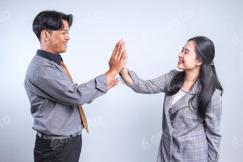 Preview: Two Young Asian Businessman And Businesswomen Making High Five