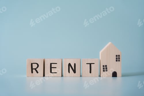 Preview: Wooden blocks wording rent and small house model concept of real estate rental