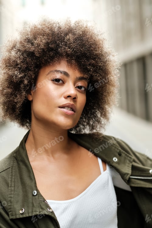 Preview: Portrait of beautiful race mixed woman in the street.
