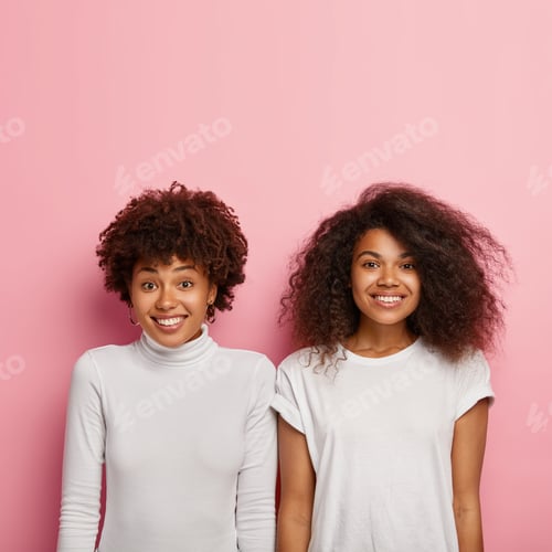 Preview: Photo of cheerful Afro American women smile broadly, have happy mood, rejoice positive news, wear wh