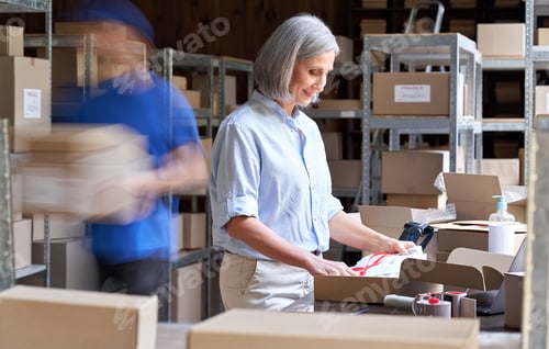 Preview: Warehouse workers hurry in blur motion to deliver parcels. Fast delivery concept