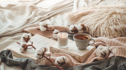 Preview: Sweaters and cup of tea with autumn decor on the books. Read, Rest.