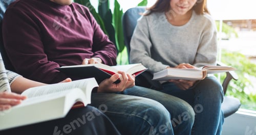 Preview: Group of young people sitting and enjoyed reading books together