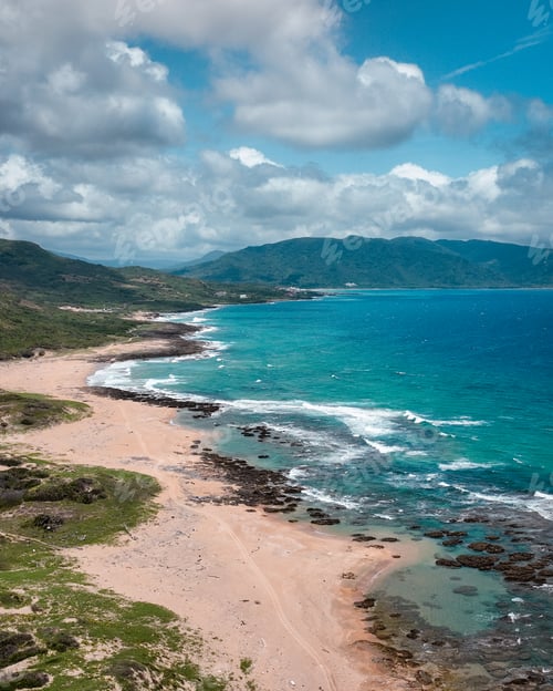 Preview: Scenic coastal view of Longpan Park showcasing golden sands and vibrant blue waters in Taiwan