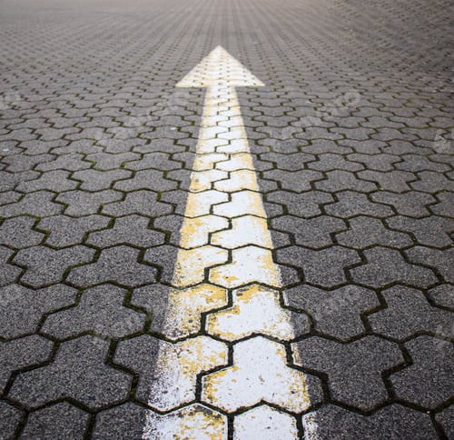 Preview: road markings, arrow on the road made of paving stones, indicating the direction forward,