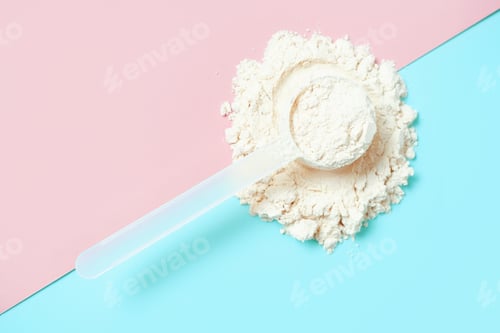 Preview: Protein powder in scoop on blue and pink background, top view.