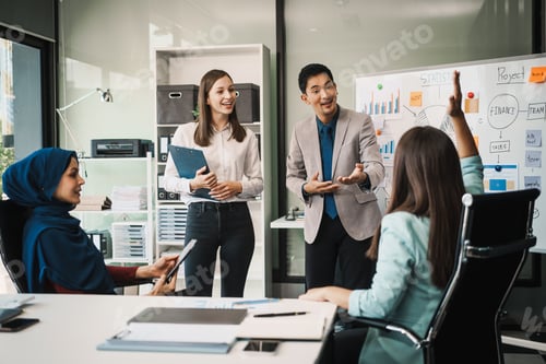 Preview: A diverse team, including a middle-aged Asian businessman, Caucasian young businesswoman
