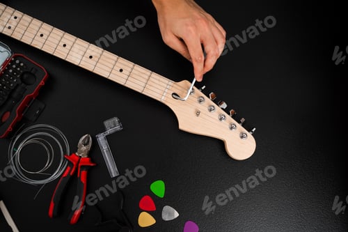 Preview: Guitar string height and intonation adjusted with hex key on bridge