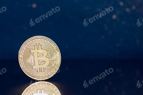 Preview: Shiny golden bitcoin blue background with copy space.