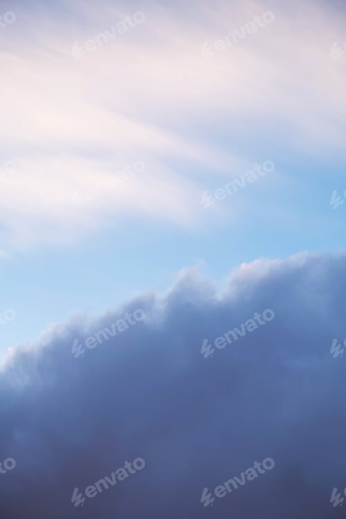 Preview: Soft pastel sky with scattered clouds in the morning light.