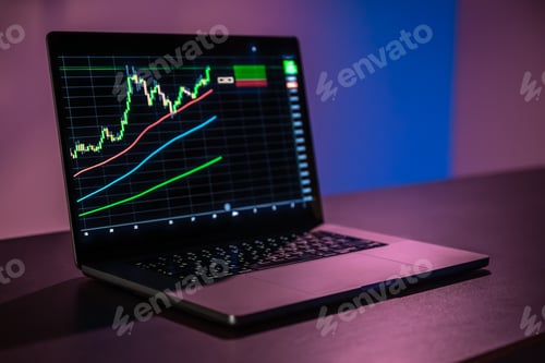Preview: Laptop screen with trading grid and moving averages. Buy signal.