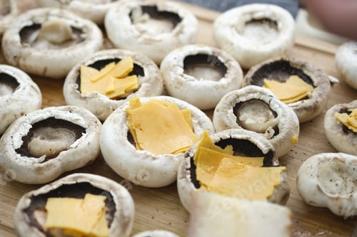Preview: Stuffed Mushrooms Ready for Cooking on Wooden Board