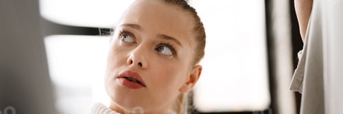 Preview: Young blonde white woman choosing clothes