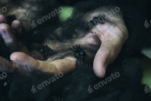 Preview: Young man with black spider web in his hands