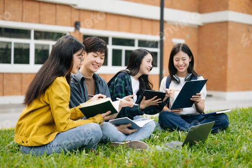 Preview: Young Asian college students and a female student group work at the campus park