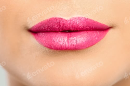 Preview: Young woman wearing beautiful lipstick, closeup view