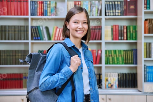 Preview: Female university student with backpack, inside library of educational building