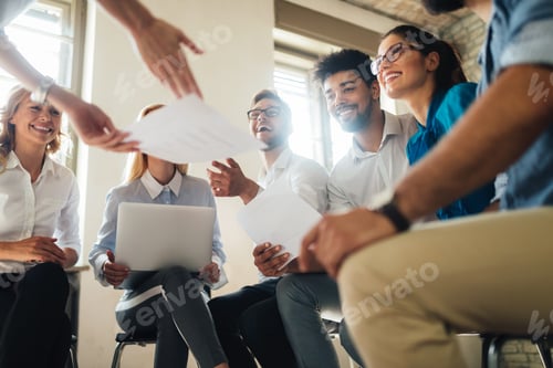Preview: Group of young businesspeople or designers work with new startup project in office