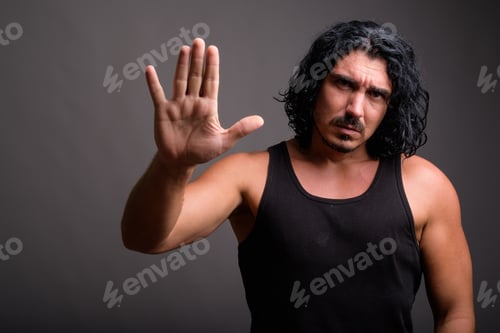 Preview: Handsome macho man with mustache against gray background