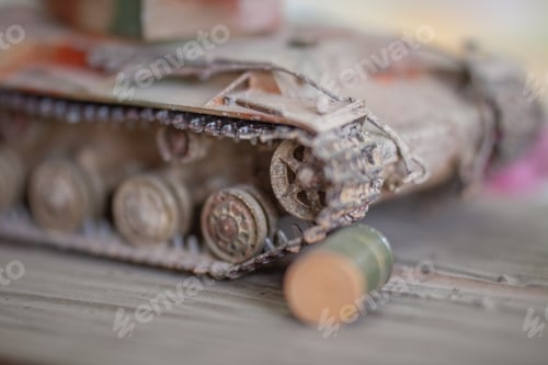 Preview: Selective focus shot of a miniature tank steel wheel