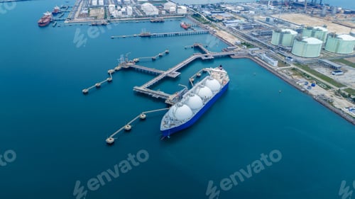 Preview: LNG (Liquified Natural Gas) tanker anchored in Gas terminal gas tanks for storage. Oil Crude Gas