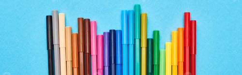 Preview: Panoramic shot of set of bright color felt-tip pens isolated on blue