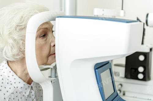Preview: Serious Old Woman Sitting Near Optical Apparatus