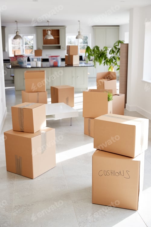 Preview: Stacked Removal Boxes In Empty Room On Moving Day