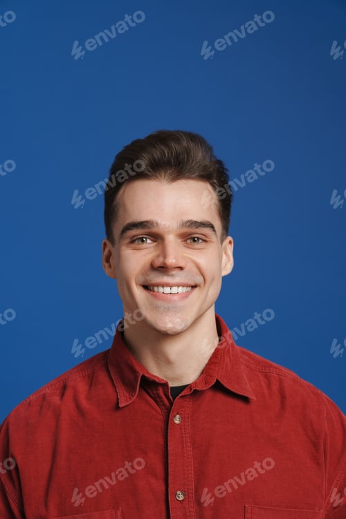 Preview: Young white man wearing shirt smiling and looking at camera