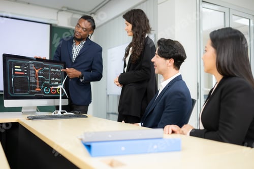 Preview: Diverse team of businessmen and engineers consultation on the engineering of a wind turbine