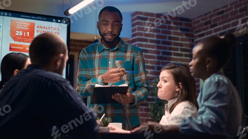 Preview: African american business coach giving presentation in company meeting