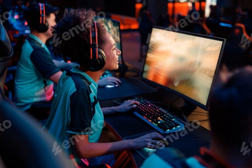 Preview: Woman gamer challenging video game in computer club